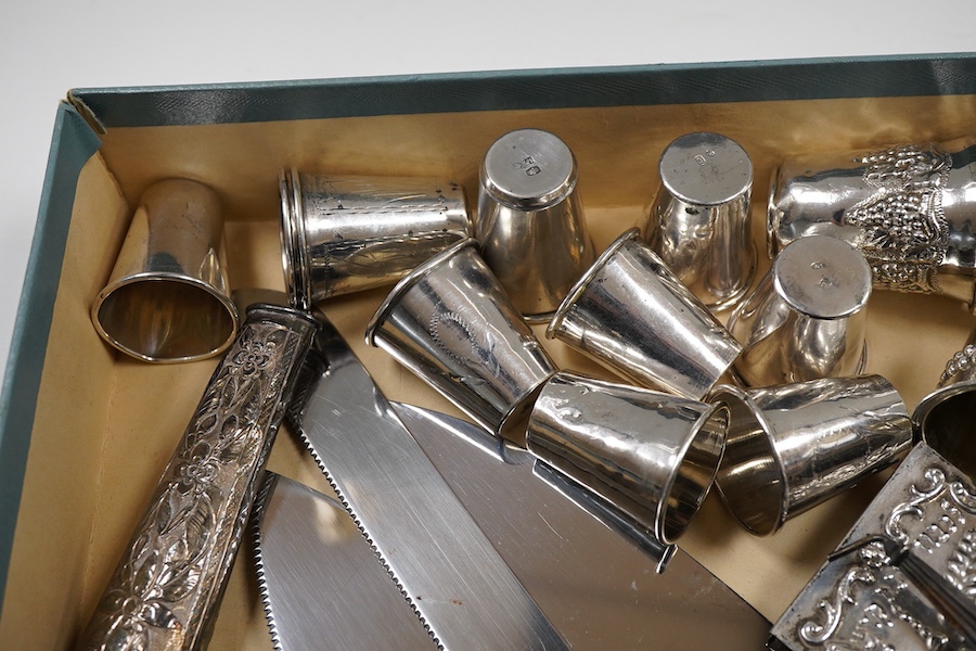 A pair of George V silver kiddush cups, maker M.S., London, 1919, 9cm, one other silver kiddush cup, two Judaic sterling tots, a set of eight Polish white metal tots, maker SJ, one other pair of Polish white metal tots,